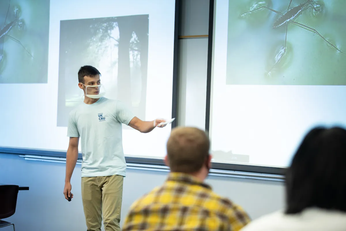 A student presenting in a clear face mask. Mark Cornelison | UK Photo.