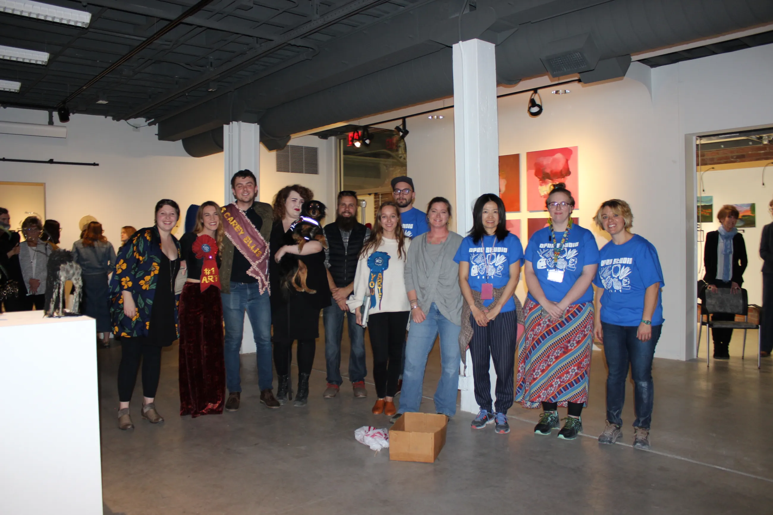 The three prize winners from the 2017 Carey Ellis Juried Student Show pose with juror and UK alumna Melanie VanHouten (in gray) and members of the Art Graduate Student Association, who helped organize Open Studio.