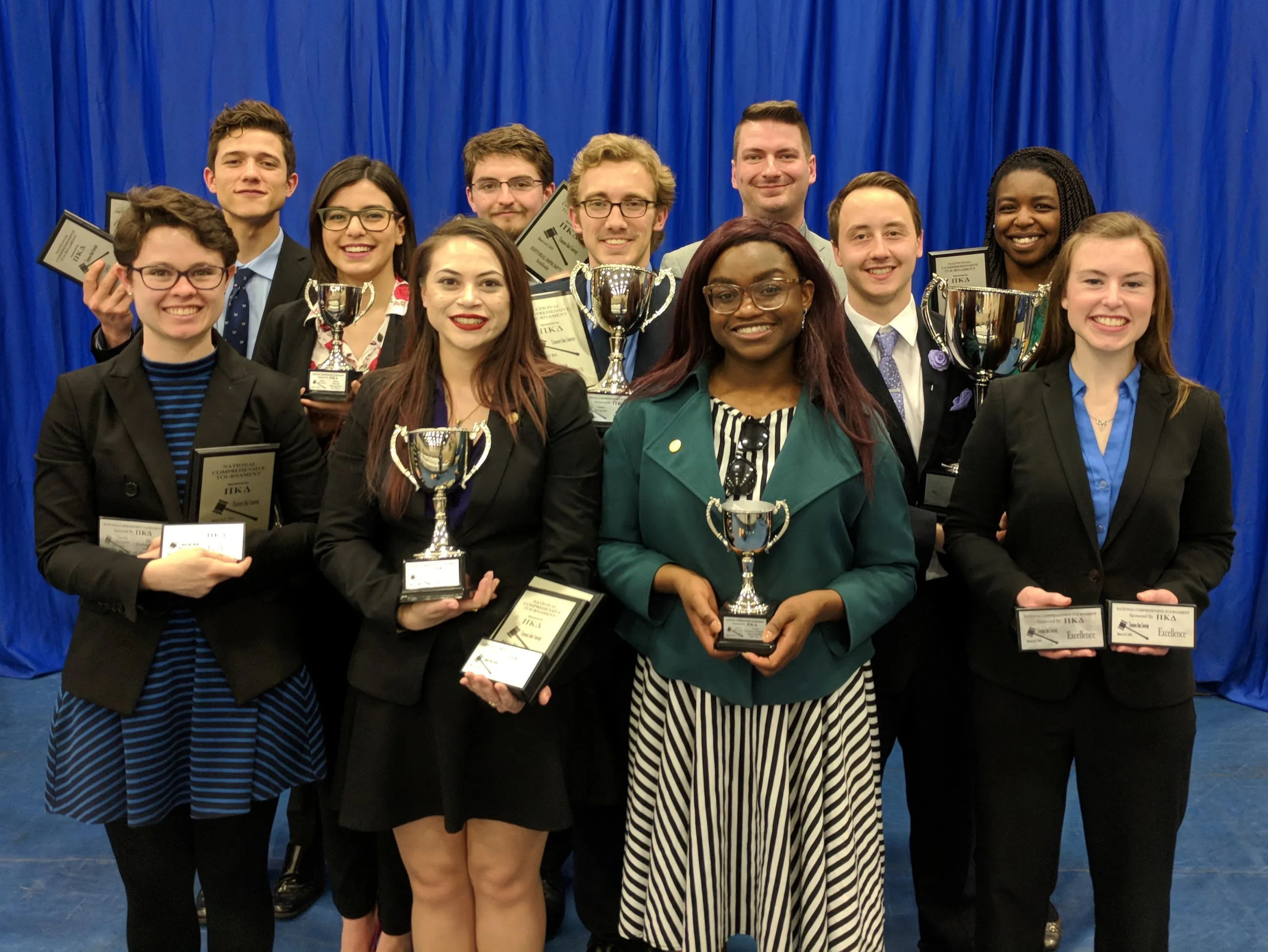 Members of the UK Speech and Debate Team after placing eighth at the Pi Kappa Delta National Comprehensive Tournament.