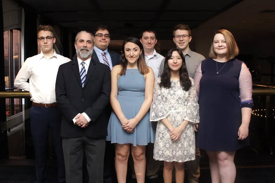 Front row, left to right: Dave Arnett (coach), Jacinda Rivas, Maria Sanchez and Genevieve Hackman. Back row, left to right: Dan Bannister, Amar Adam (coach), Lincoln Garrett (coach) and Anthony Trufanov. Photo provided by the NDT.