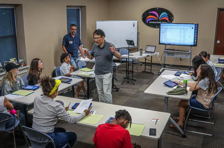 UK Associate Professors Yung Soo Kim and David Stephenson led the workshop, teaching local preteens and teenagers essential multimedia storytelling skills. Photo by Jeremy Midkiff.