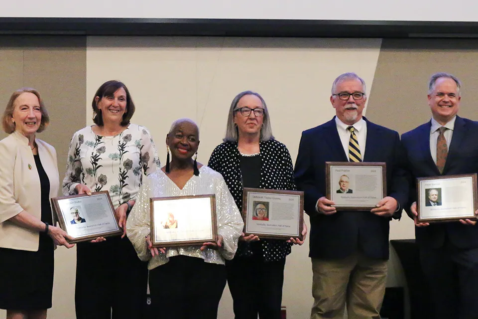 From left, Sheldon Shafer (represented by two of his former coworkers), Betty Winston Bayé, Deborah Taylor Givens, Paul Prather and Peter Baniak. Not pictured: Elizabeth “Scoobie” Ryan and Kyle Vance. Photo credit: Reese Durham.