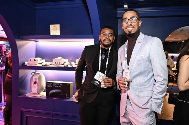 Counter Fin co-founders Camron Brown and Kaelaan Maynor stand smiling at an event.