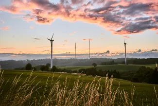 Wind turbines help Morris residents save money on their electrical bills. (Photo by Bastian Pudill, Unsplash)