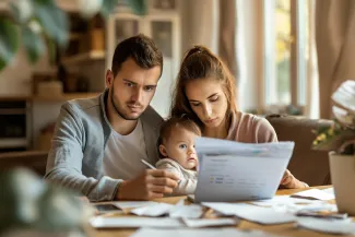 When U.S. families sit down to do the budget, some costs aren't negotiable. (Adobe Stock photo)