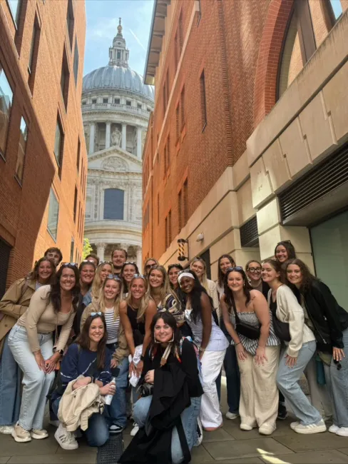 Study abroad students pose in front of St Paul Cathedral