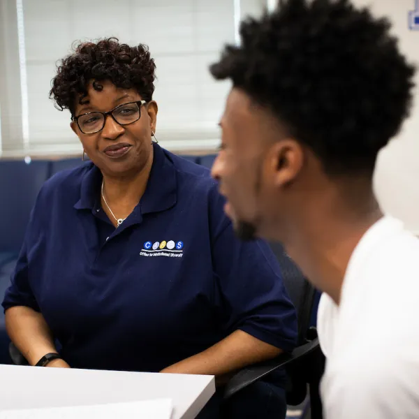 Toni Thomas (left), director for UK's Center for Academic Resources and Enrichment Services (CARES), talks with a student. A new support fund created by UK alumna Mary deGraaf will support students and programming in CARES. Pete Comparoni | UK Photo.