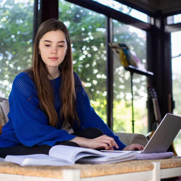 Ella Webster, a freshman at UK, does coursework from home due to COVID-19. Pete Comparoni | UK Photo.