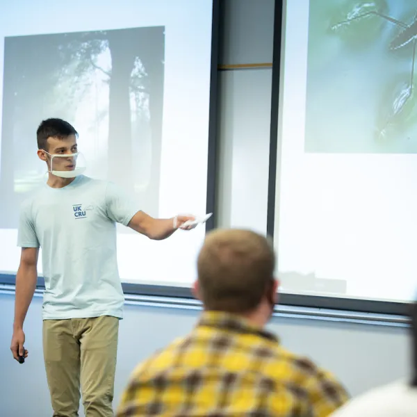 A student presenting in a clear face mask. Mark Cornelison | UK Photo.