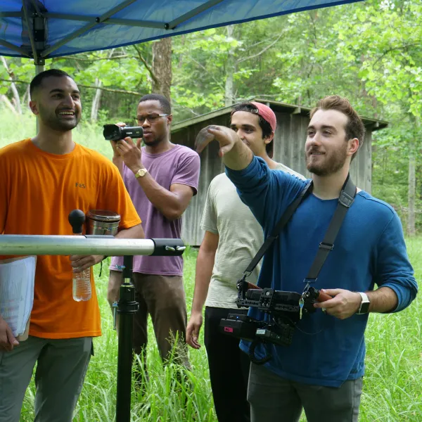 Matthew Dunlap (right) and his crew work on the set of "Burning In Trial" on location in the Red River Gorge.