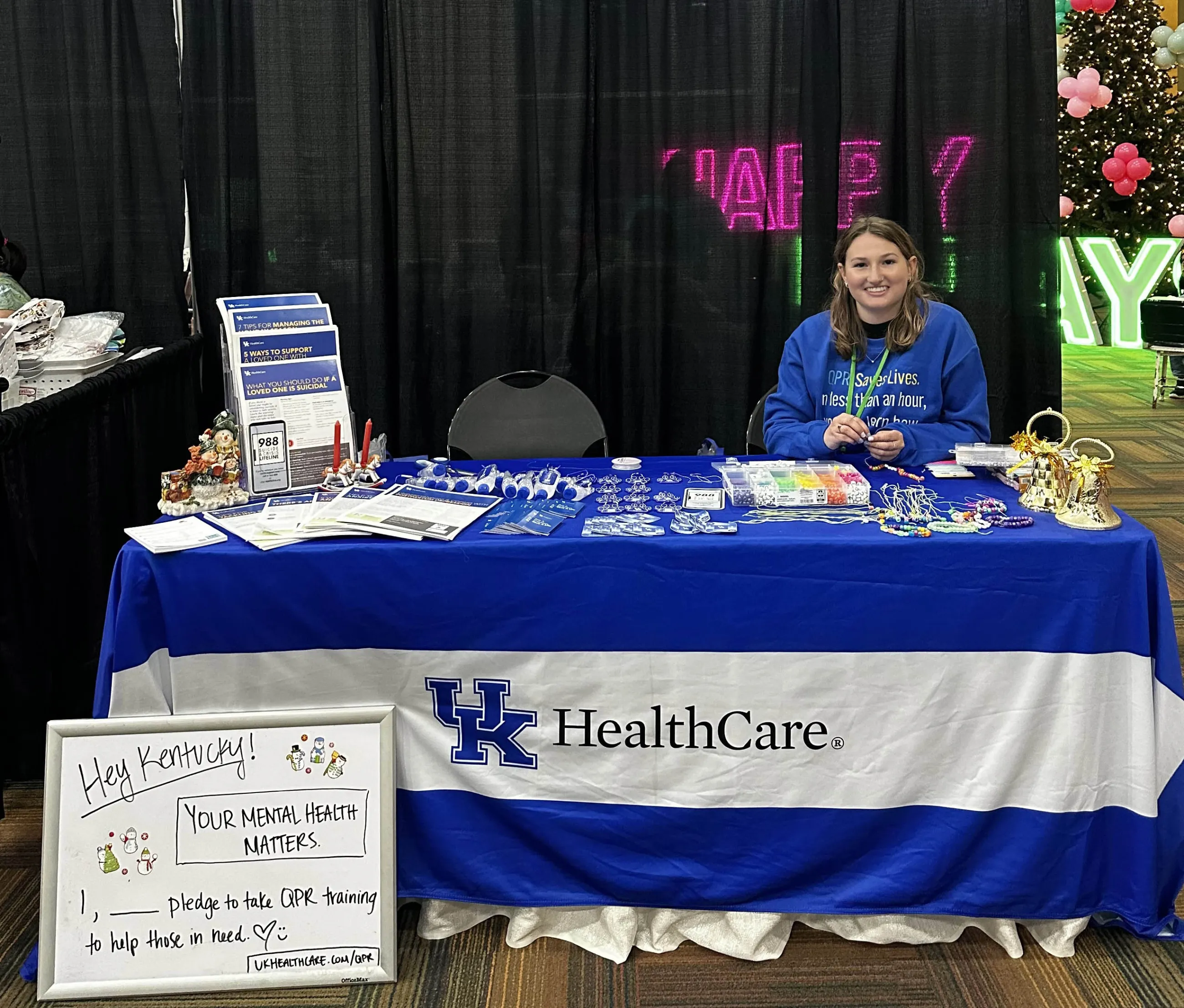 CC Rhein tabling at the Junior League Holly Days market.